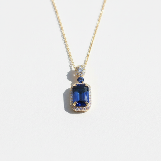 Blue sapphire pendant - white surface